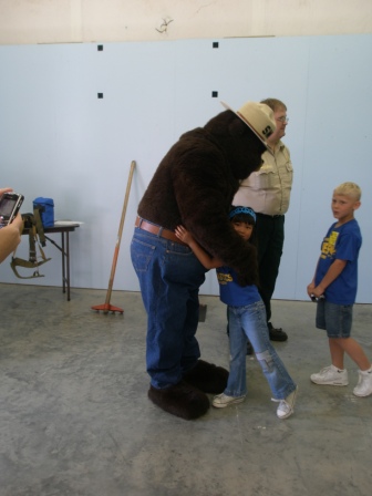 Kasen hugging Smokey Bear